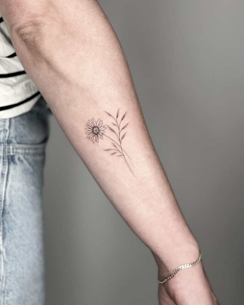 Minimalist Daisy Forearm Tattoo april birth flower tattoo ideas tattoo