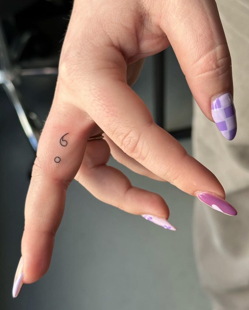 Minimalist Finger Semi-Colon Tattoo meaningful semicolon tattoo ideas tattoo