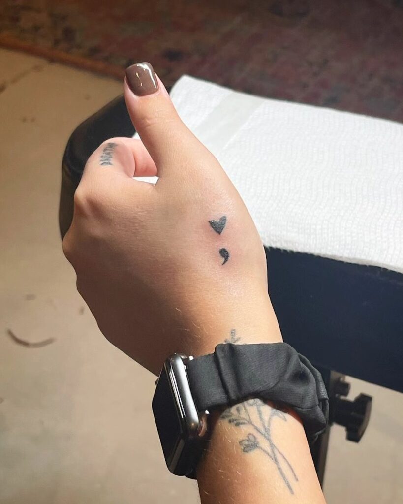 Minimalist Heart and Semi-Colon Tattoo on the Hand meaningful semicolon tattoo ideas tattoo