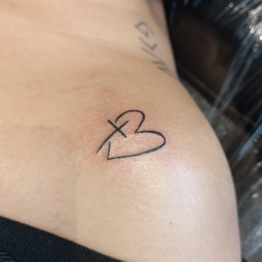 Double Heart Outline with Tiny Accent small heart tattoo ideas tattoo