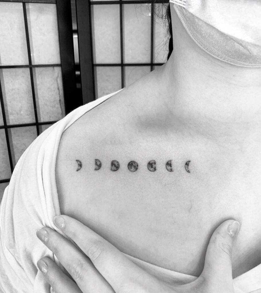 Delicate collarbone moon phases tattoo