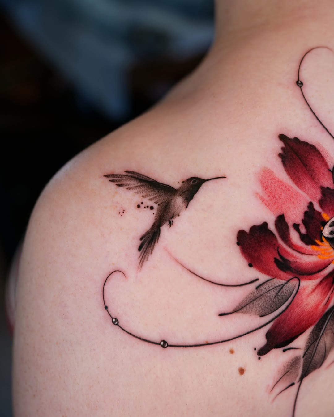 Minimalist Hummingbird and Red Flower Tattoo hummingbird tattoos ideas tattoo