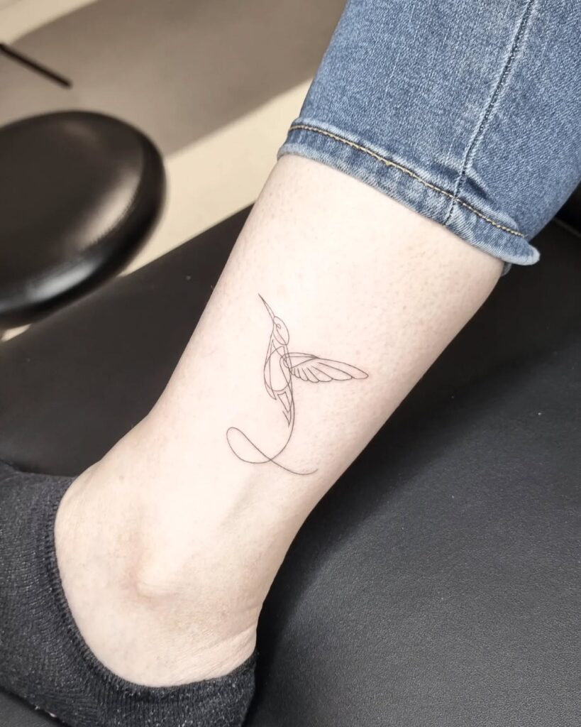 Minimalist Hummingbird Ankle Tattoo hummingbird tattoos tattoo