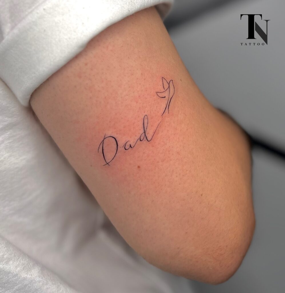 Minimalist “Dad” with Dove Tattoo dad tattoo ideas tattoo