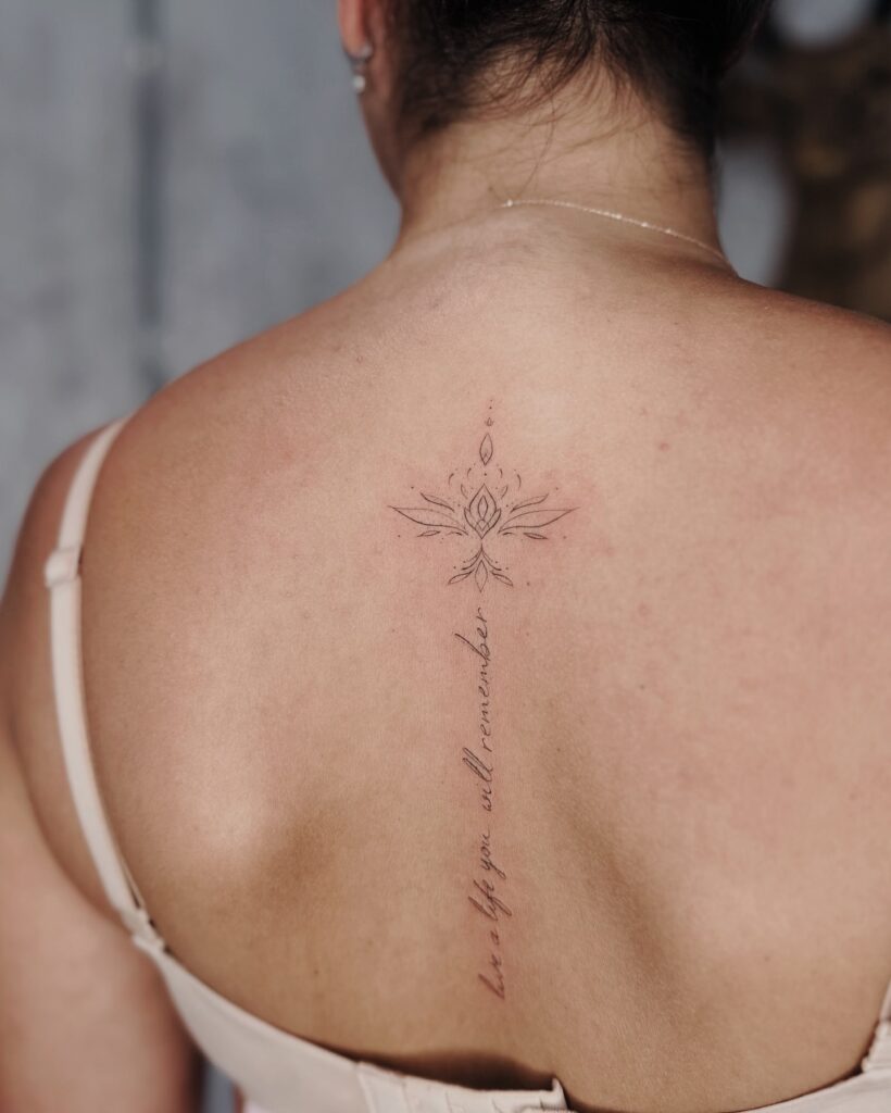 Sacred Lotus Spine Tattoo