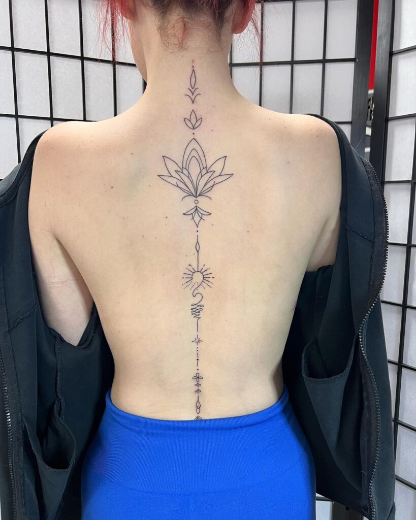 Ornate Floral And Spine Fusion Tattoo