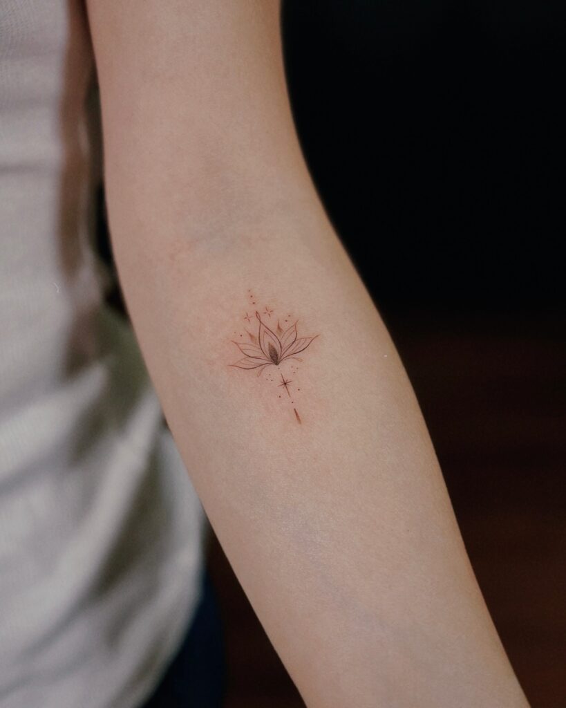 Minimalist Lotus Glow Tattoo