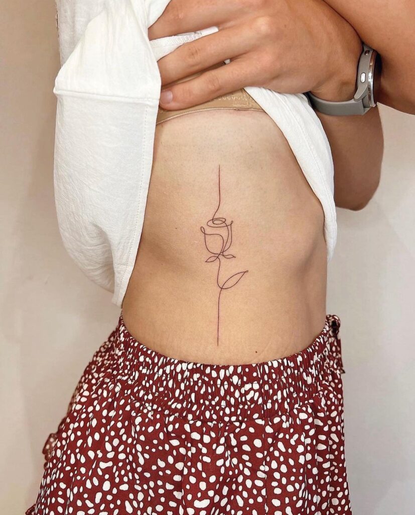 Minimalist One-Line Rose Tattoo on Rib rose tattoos for women tattoo