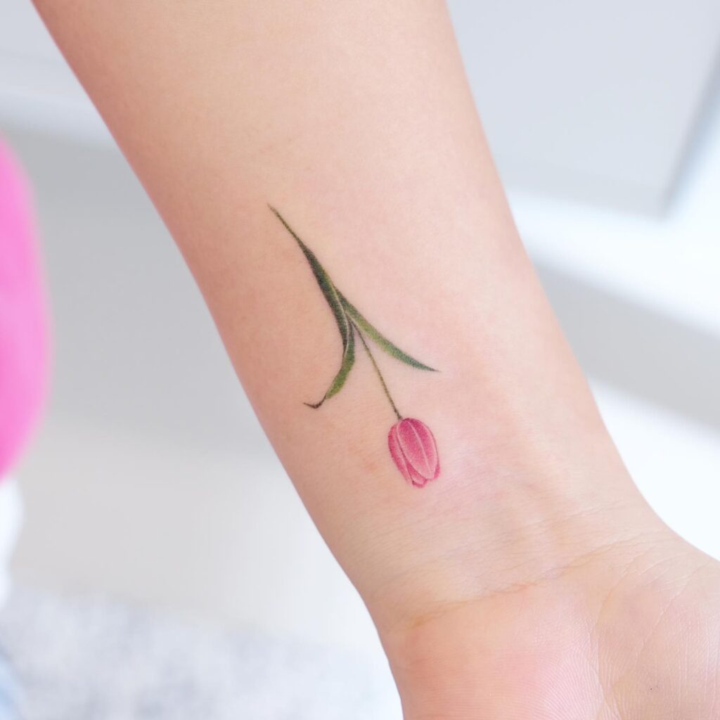 Minimalist Pink Tulip Wrist Tattoo flower wrist tattoo ideas tattoo