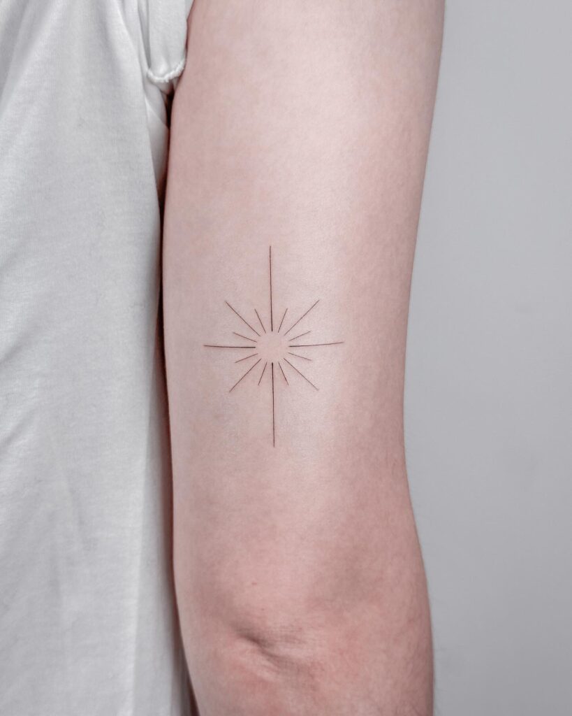 Minimalist Radiant Star Tattoo
