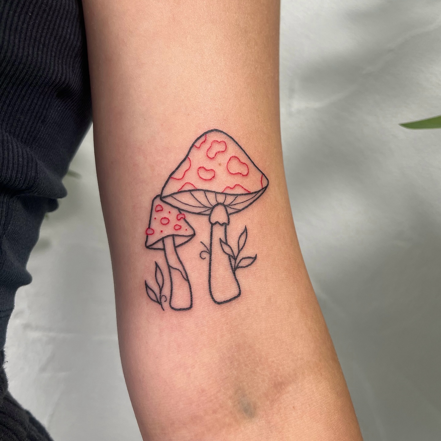 Fine Line Mushroom Tattoo with Leaves mushroom tattoo ideas tattoo