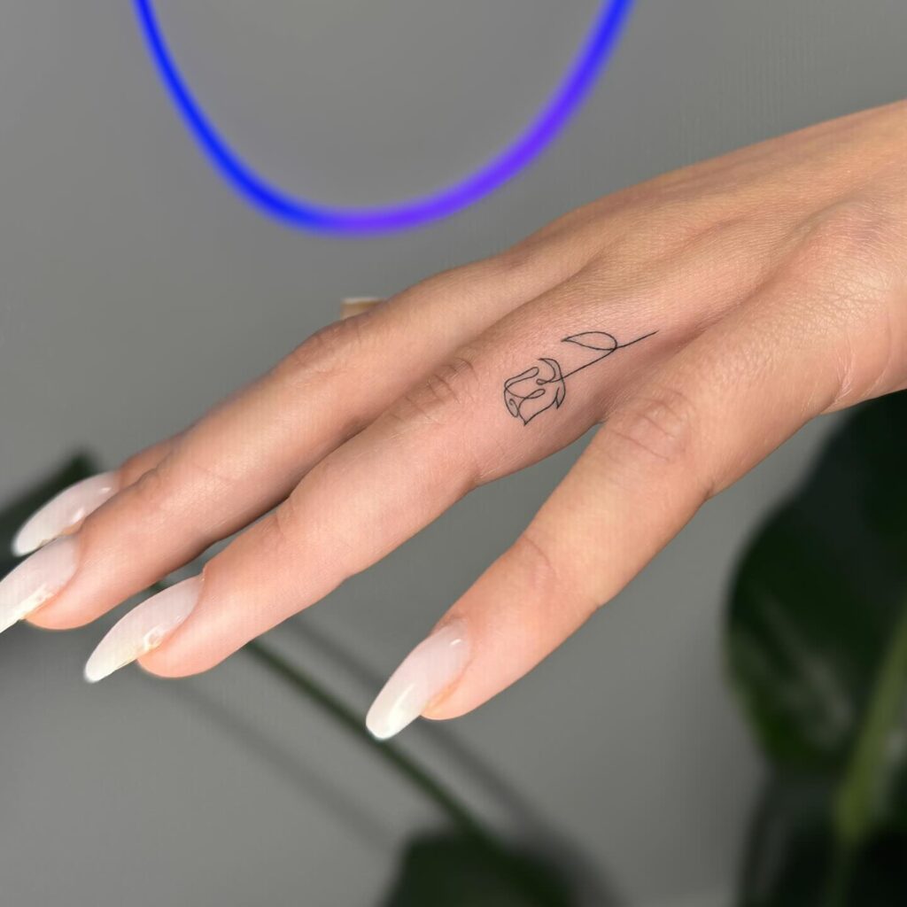 Dark Ornamental Finger And Hand Tattoo