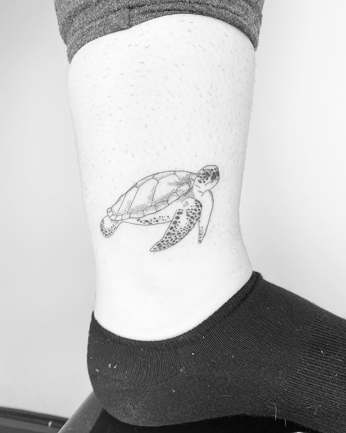 Minimalist Single Needle Ankle Voyager sea turtle tattoo