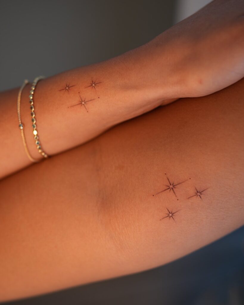 Minimalist Sparkling Stars Tattoo