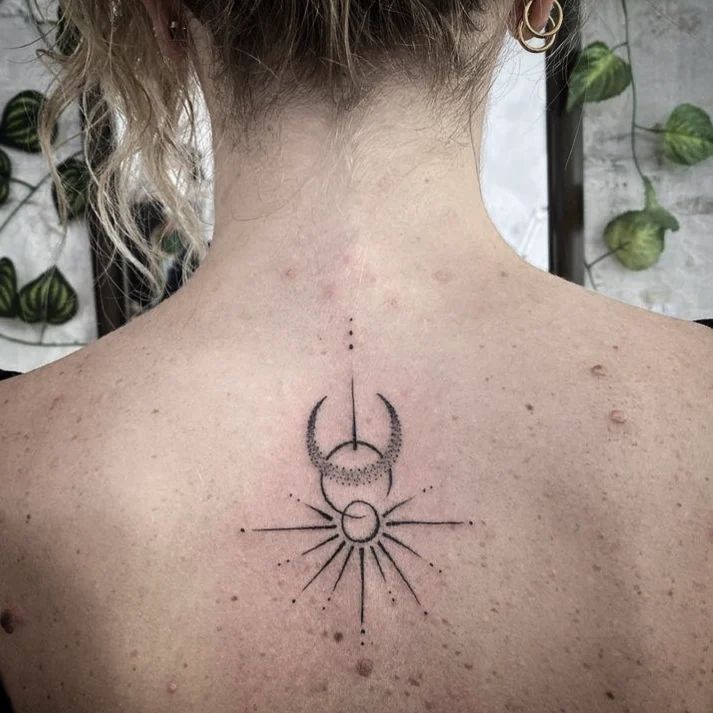 Minimalist Sun and Moon Back Tattoo symbolic sun and moon tattoo ideas tattoo