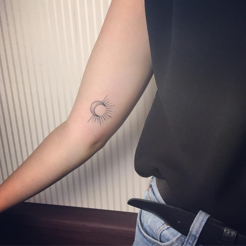 Minimalist Sun and Moon Eclipse Tattoo symbolic sun and moon tattoo ideas tattoo