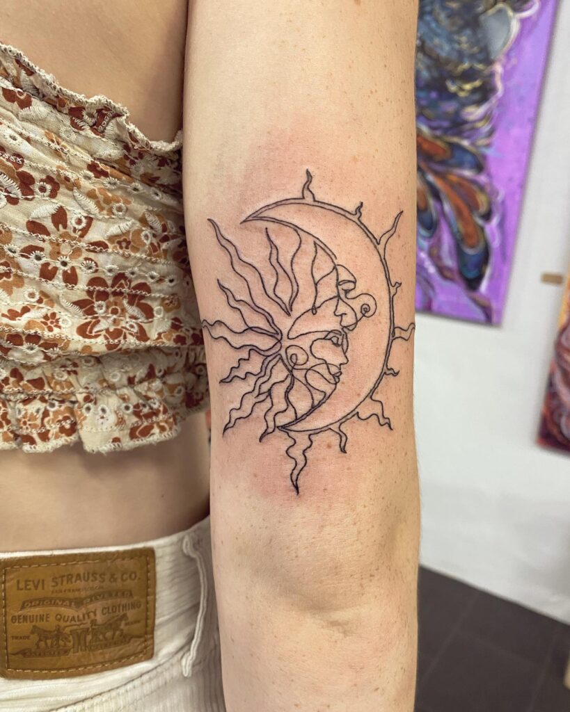 Minimalist Sun and Moon Embrace Tattoo symbolic sun and moon tattoo ideas tattoo