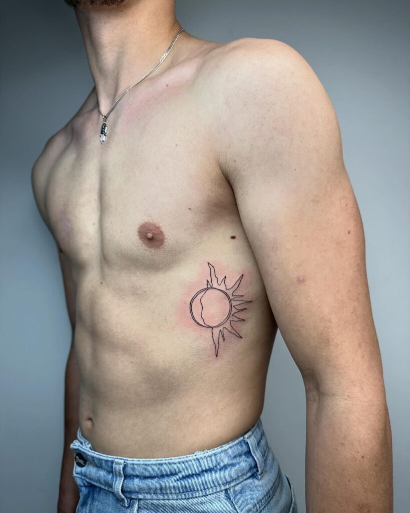 Minimalist Sun and Moon Rib Tattoo symbolic sun and moon tattoo ideas tattoo