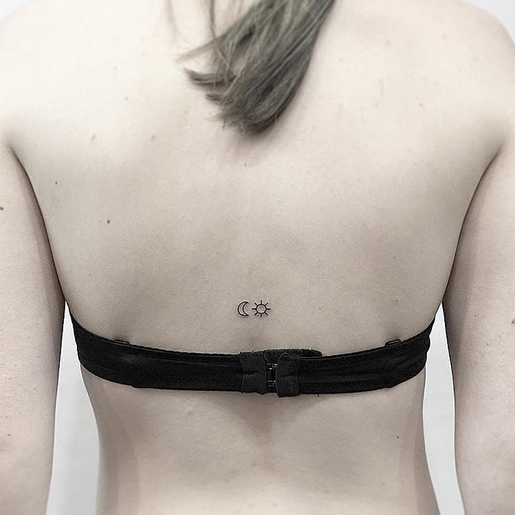 Minimalist Sun and Moon Spine Tattoo symbolic sun and moon tattoo ideas tattoo