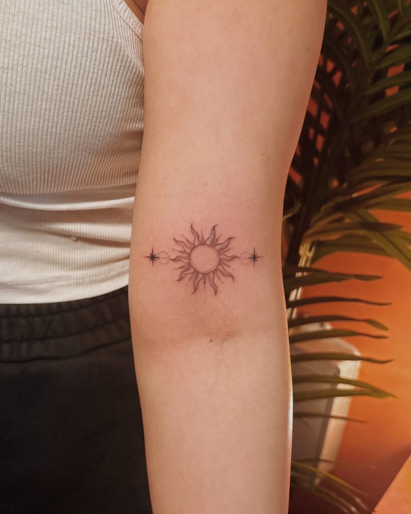 Minimalist Sun and Stars Arm Tattoo sun tattoos tattoo