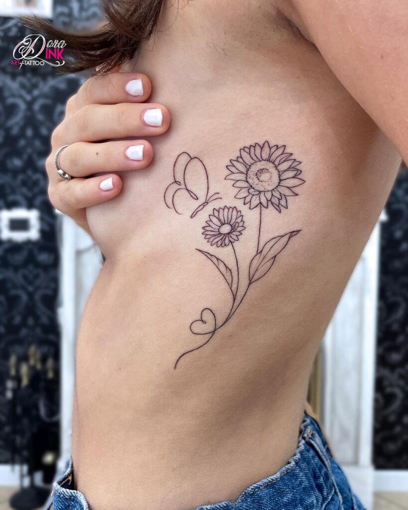 Minimalist Sunflower and Butterfly Ribcage Tattoo sunflower tattoos tattoo