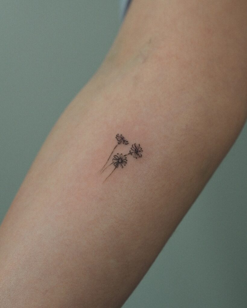 Minimalist Trio of Daisies Tattoo april birth flower tattoo ideas tattoo
