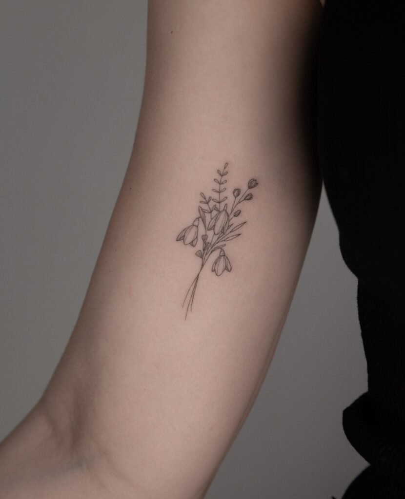 Graceful Koi Fish Upper Arm Tattoo