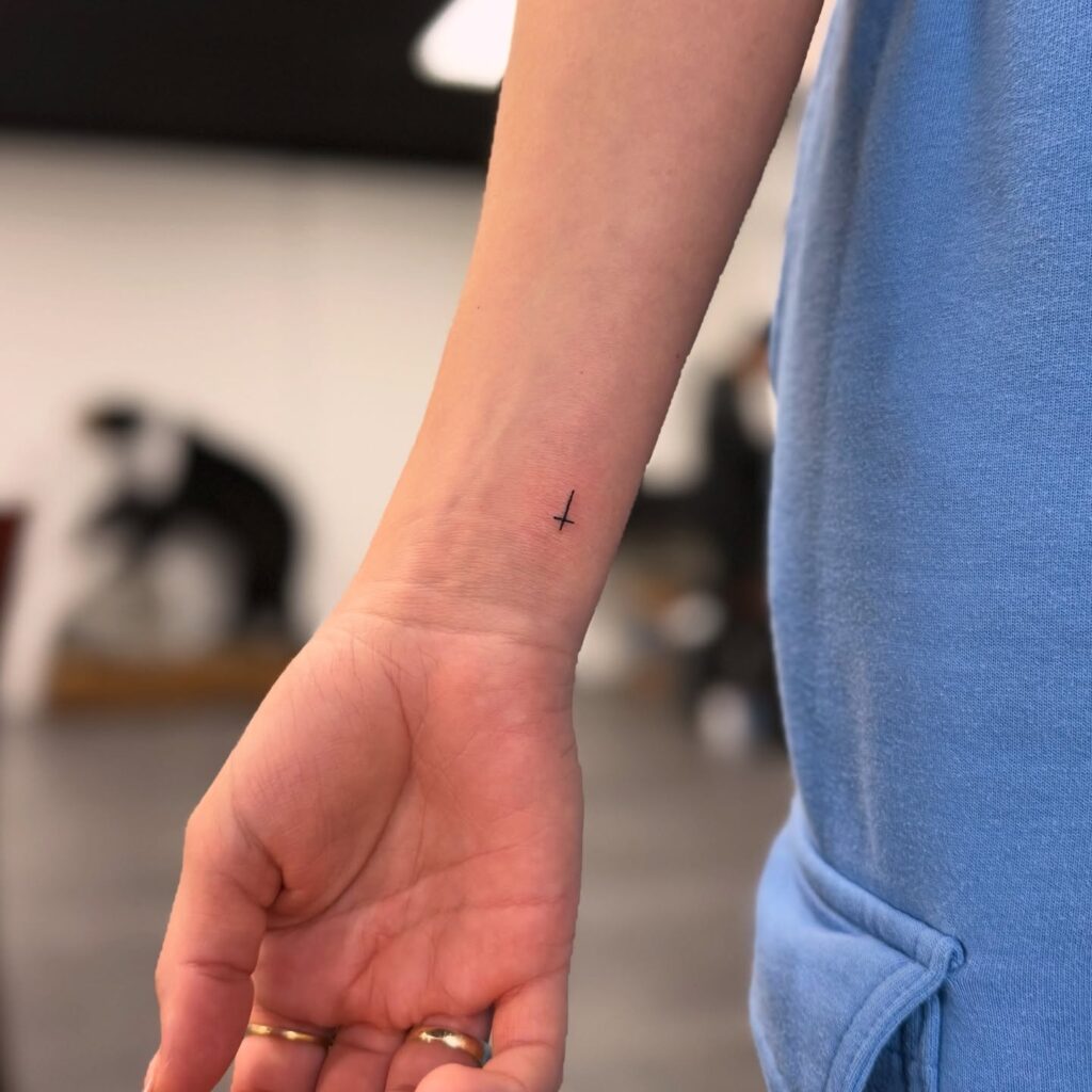 Minimalist Wrist Cross Tattoo