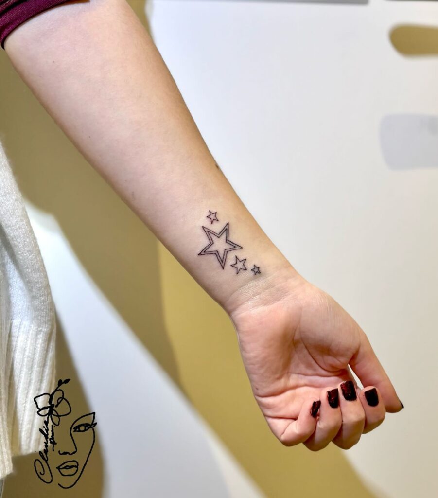Elegant Star Cross Tattoo