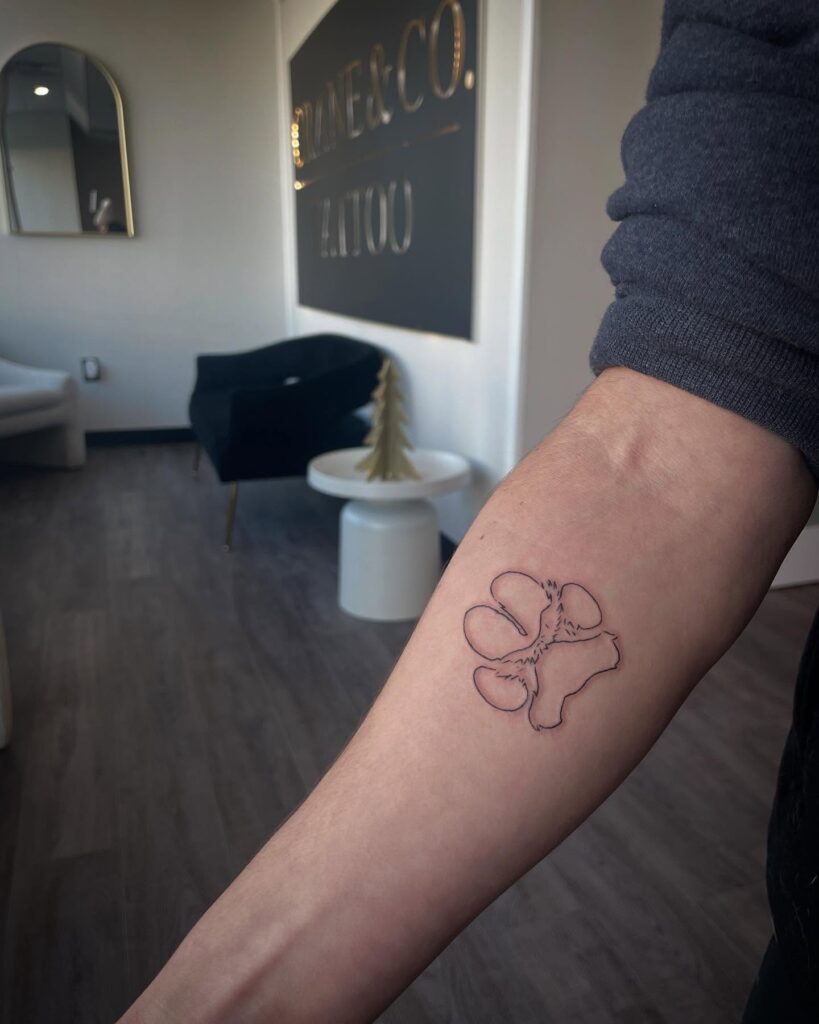 Minimalistic Paw Print Outline Tattoo paw print tattoo ideas tattoo