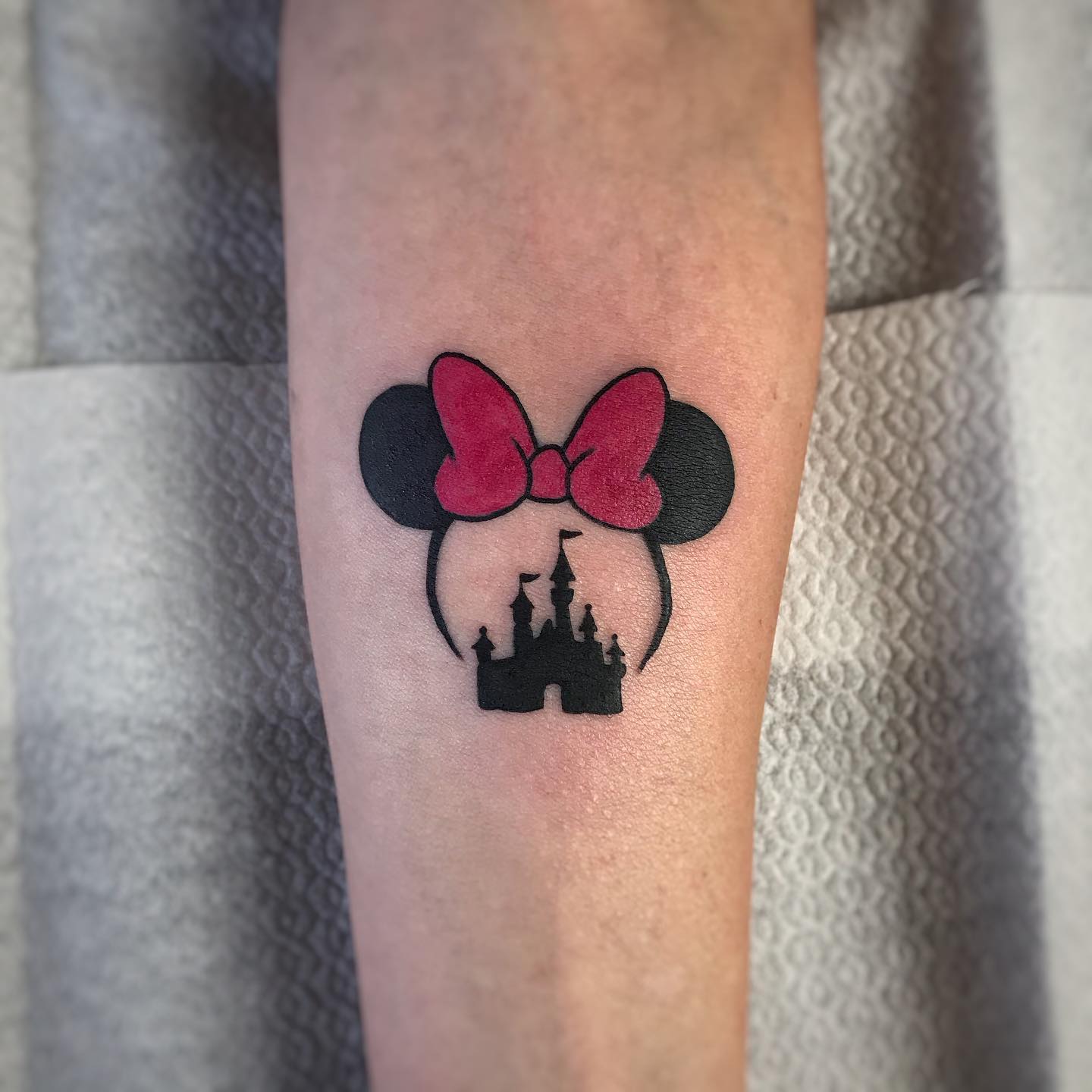 Minnie Bow and Castle Forearm Tattoo