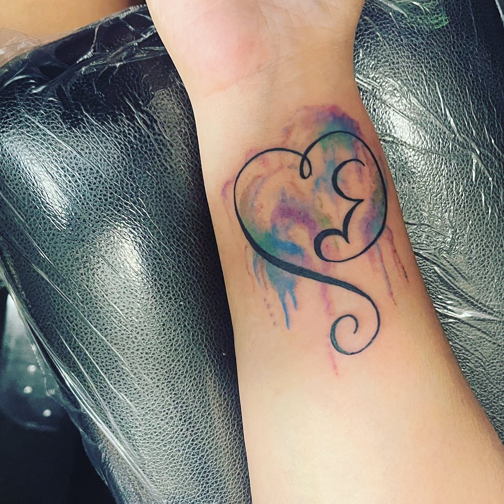 Minimalist Rainbow Miscarriage Tattoo