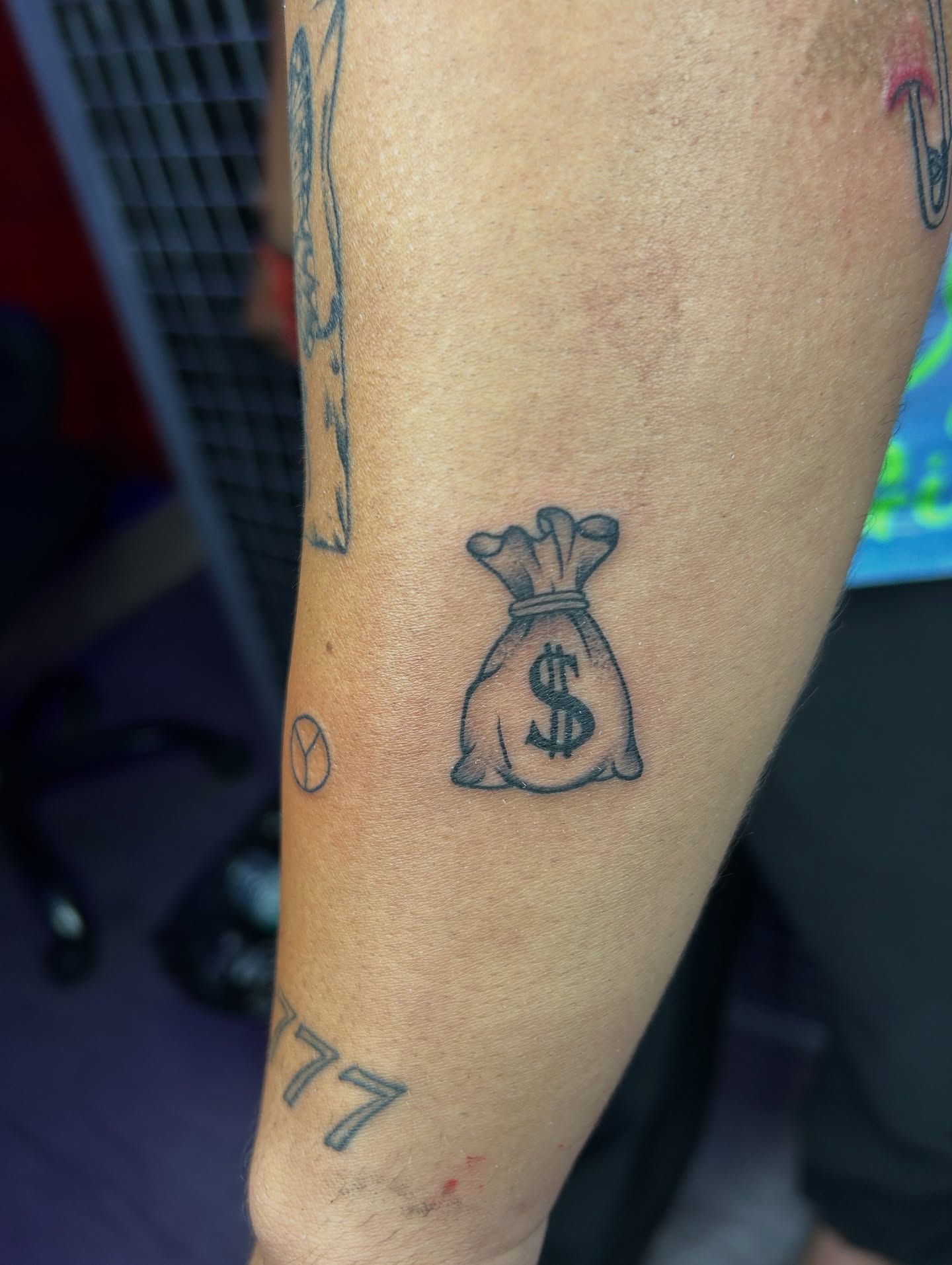 Money Bag Forearm Tattoo