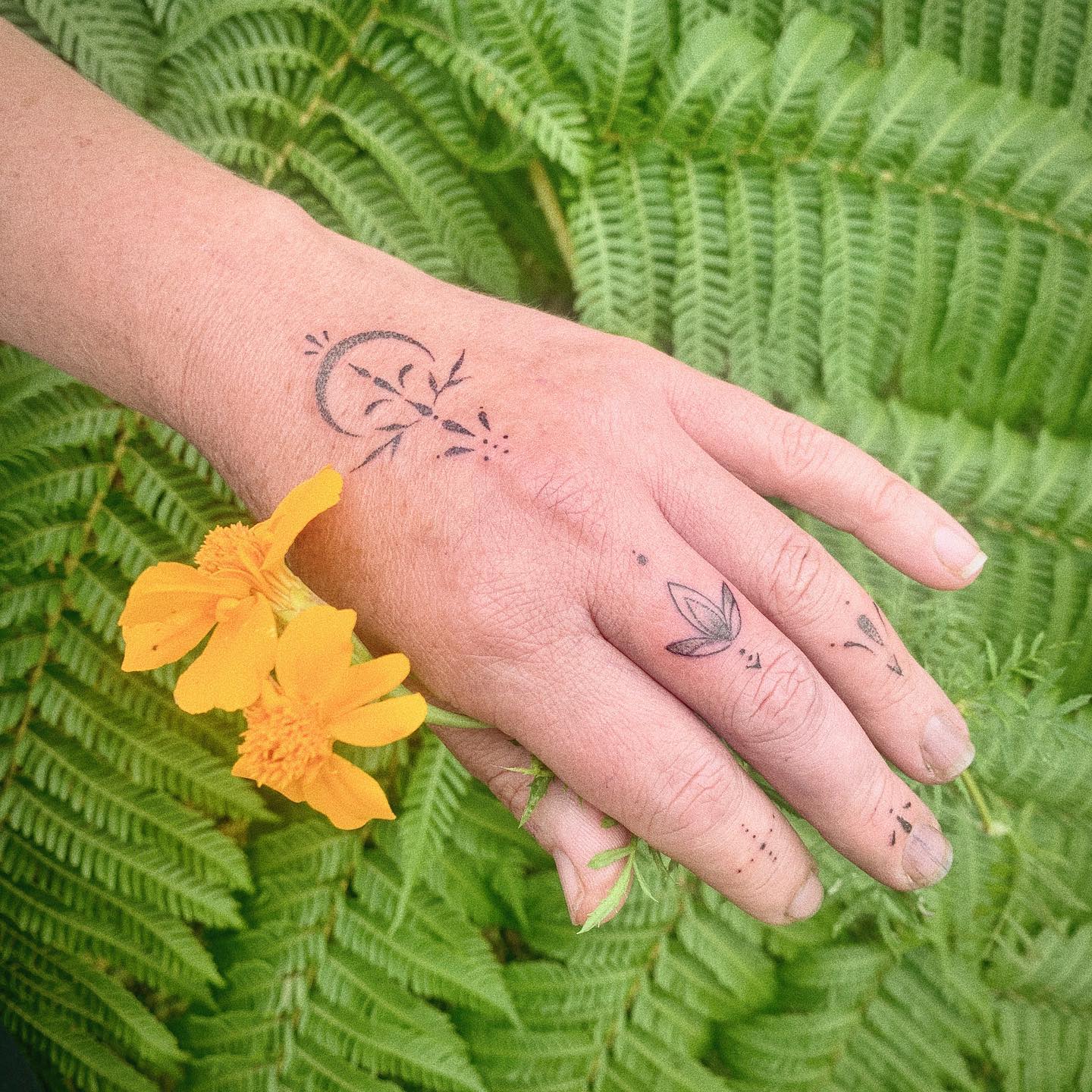 Ornamental Vine Hand And Wrist Tattoo