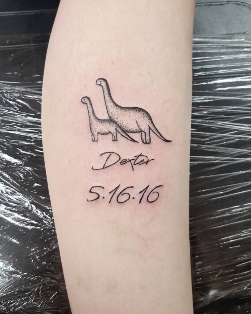 Mother and Baby Dinosaur Tattoo with Name and Date mom and son tattoo ideas tattoo