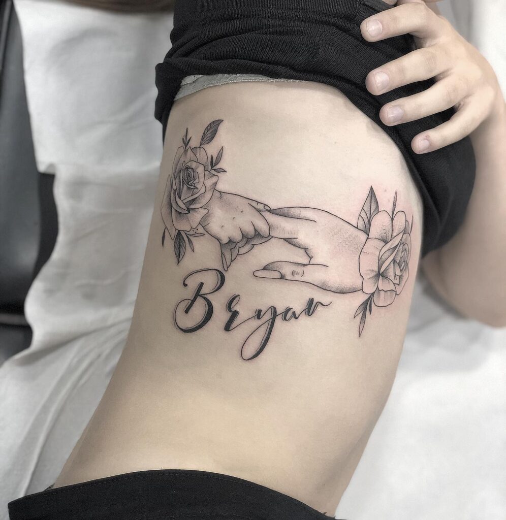 Mother and Child Hand Holding with Roses Tattoo mommy tattoo ideas tattoo