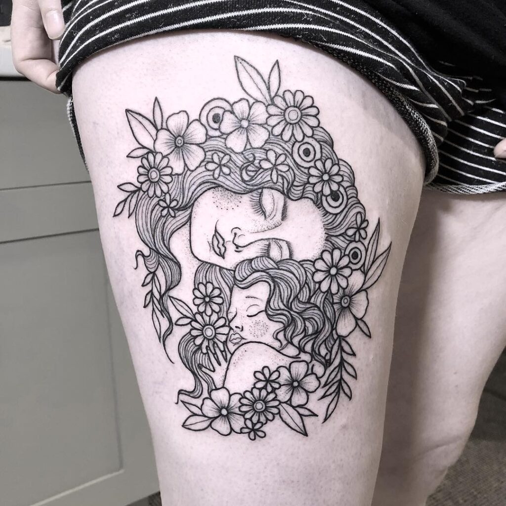 Mother and Child Surrounded by Flowers Tattoo mommy tattoo ideas tattoo
