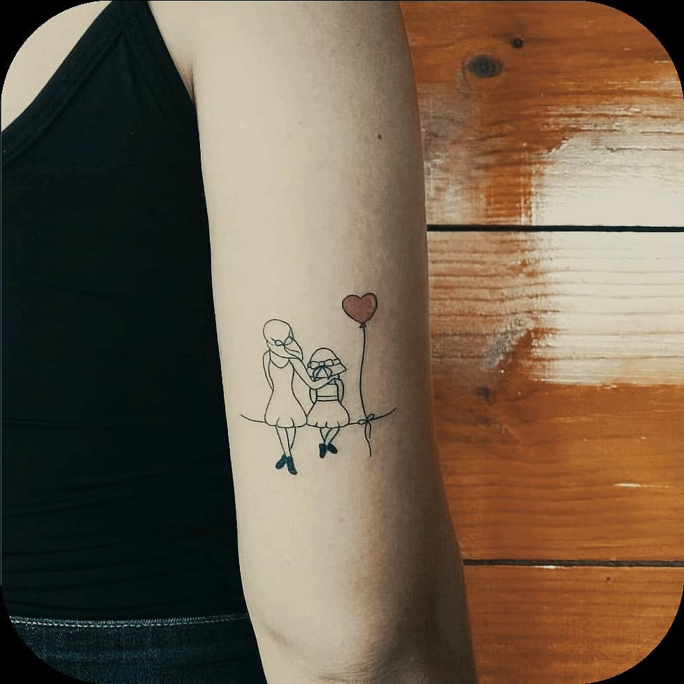 Mother and Child with Heart Balloon Tattoo mommy tattoo ideas tattoo