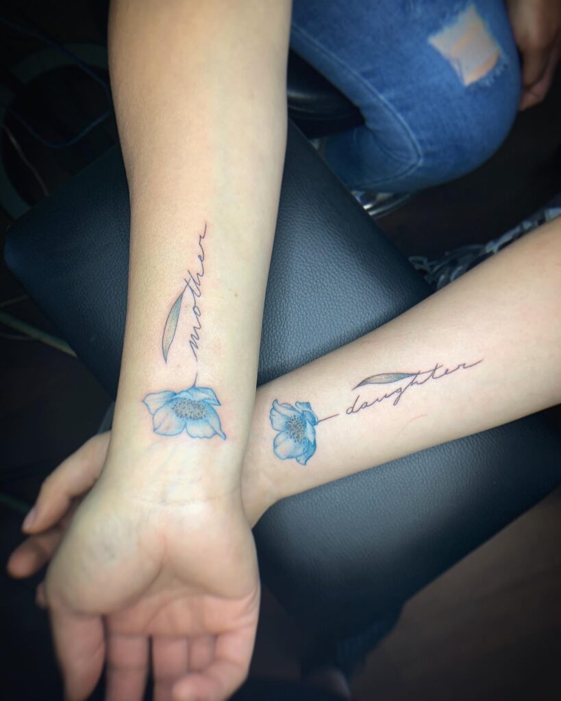 Mother-Daughter Floral Script Tattoo mother and daughter tattoo ideas tattoo