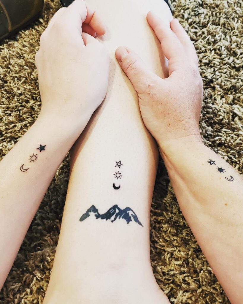 Mountain and Celestial Symbols Mother-Daughters Tattoo mother and daughter tattoo ideas tattoo