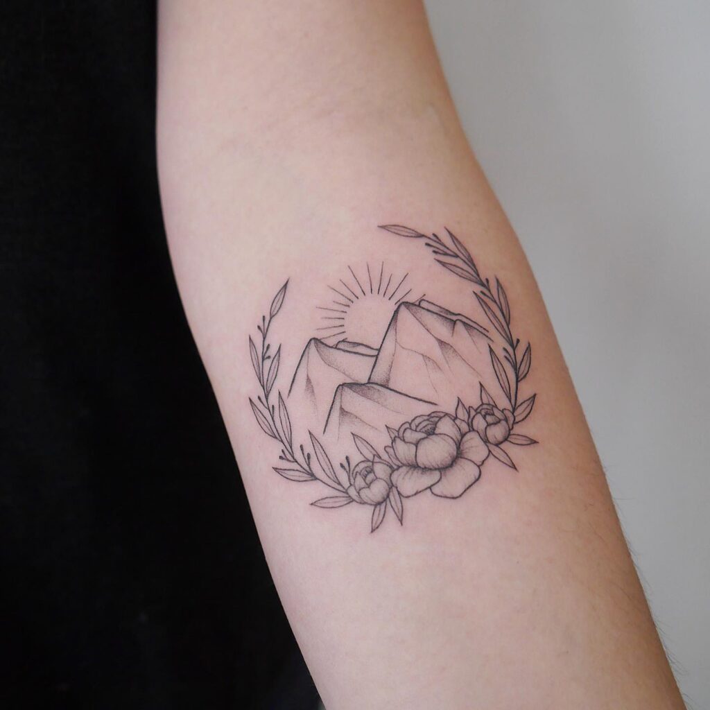Mountain and Floral Wreath Tattoo mountain tattoos tattoo