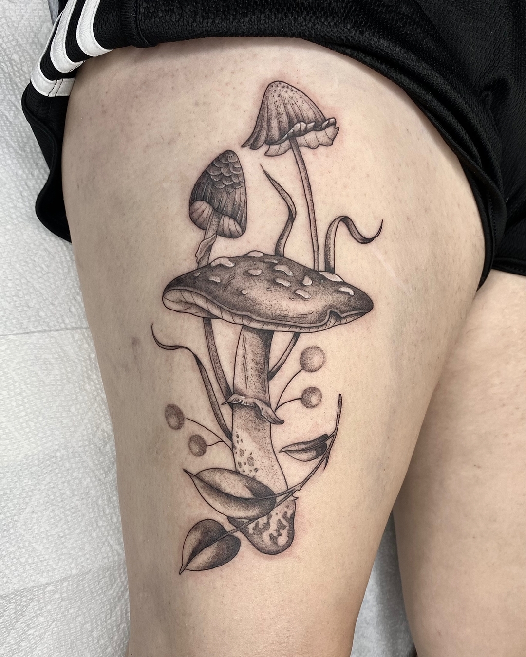 Mushroom Terrarium Tattoo with Bright Watercolor Details mushroom tattoo ideas tattoo