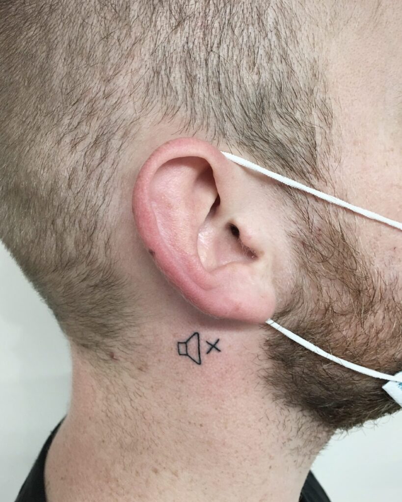 Bold Minimalist Cross Behind the Ear behind the ear tattoo ideas for men tattoo