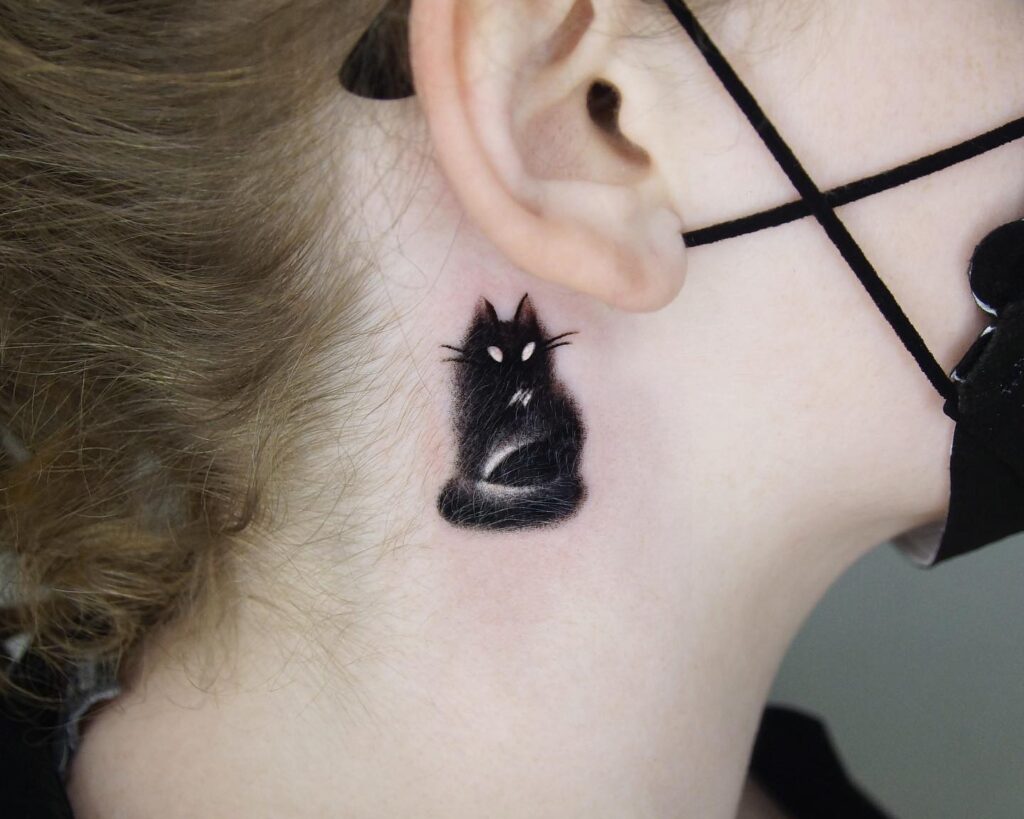 Mysterious Black Cat Behind the Ear Tattoo small cat tattoos tattoo