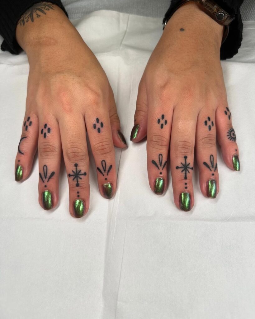 Elegant Lotus Finger Tattoo