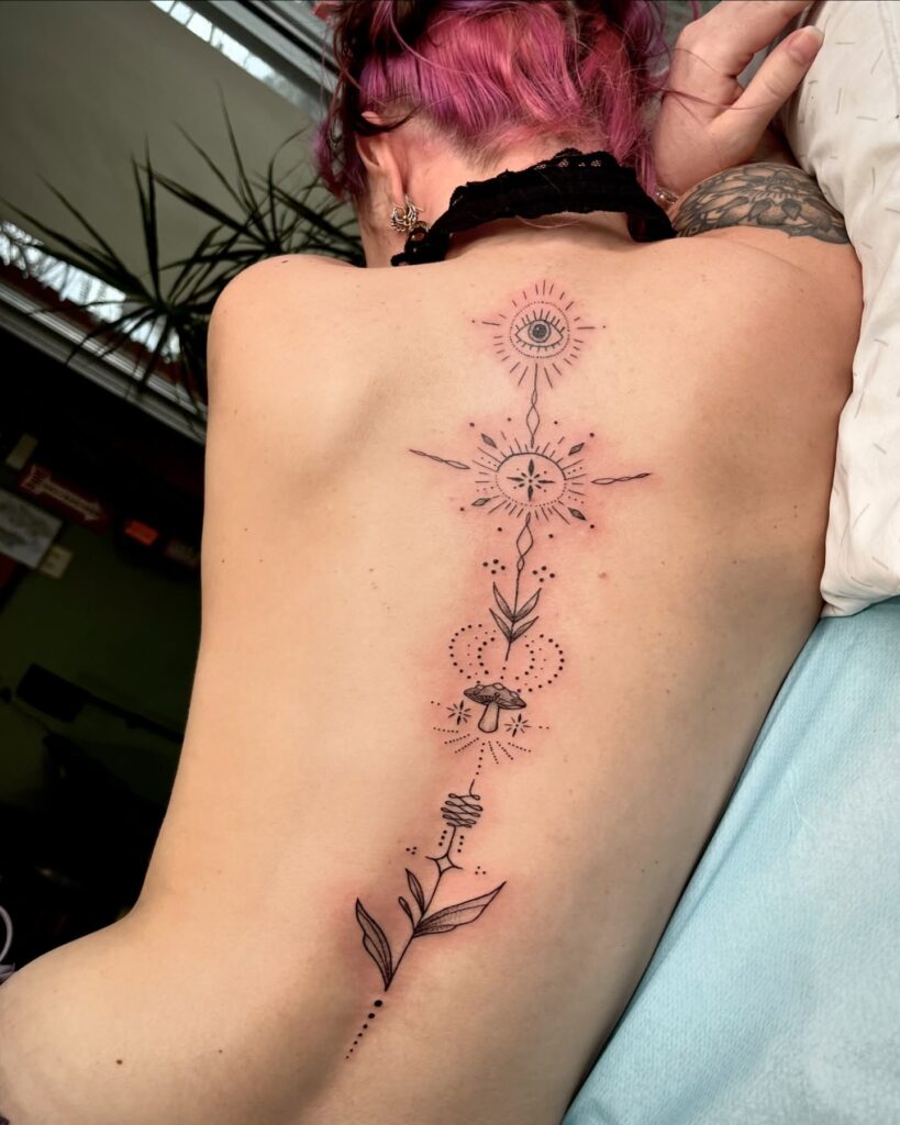 Enchanted Floral And Butterfly Spine Tattoo