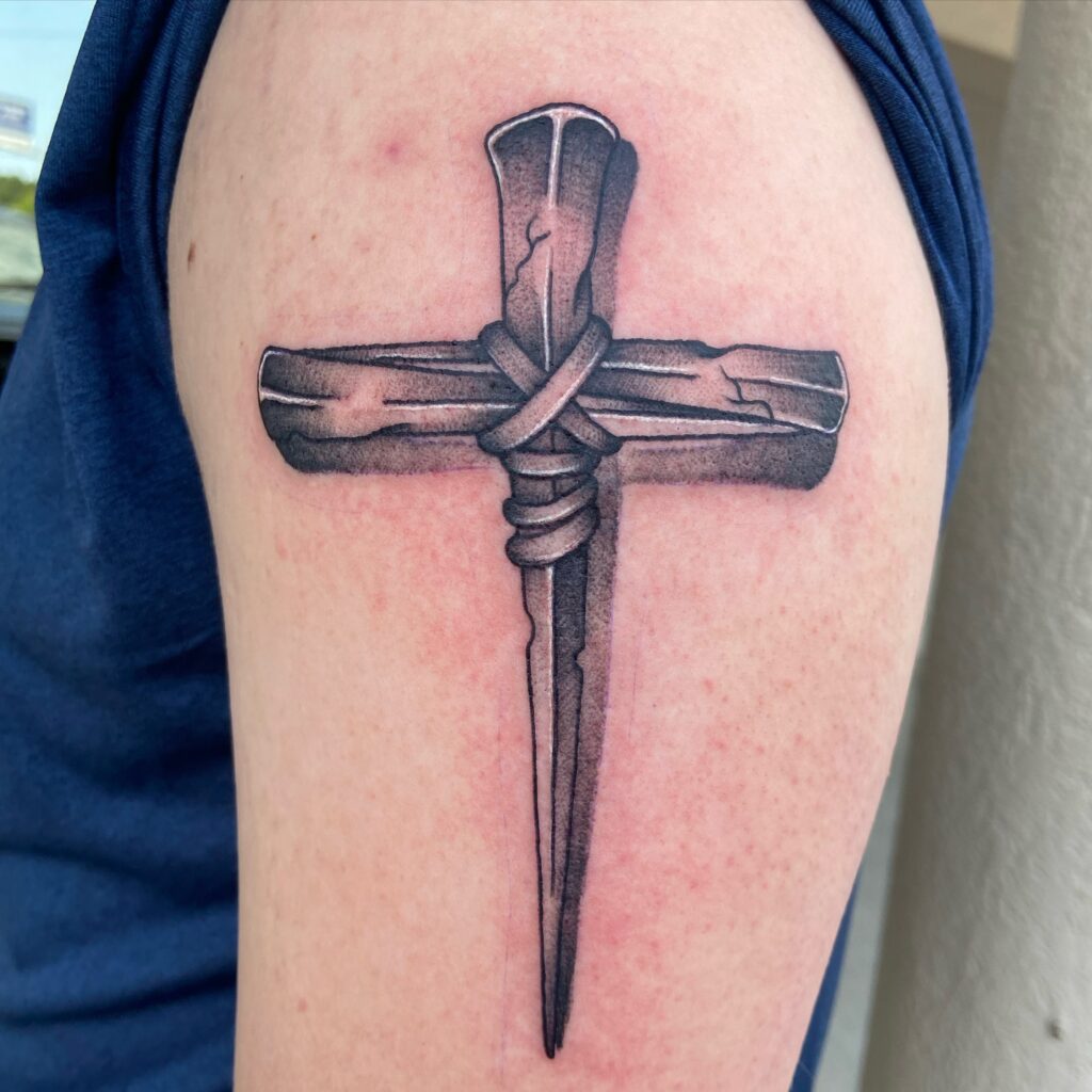 Nails Cross Tattoo on Upper Arm cross tattoos for men tattoo