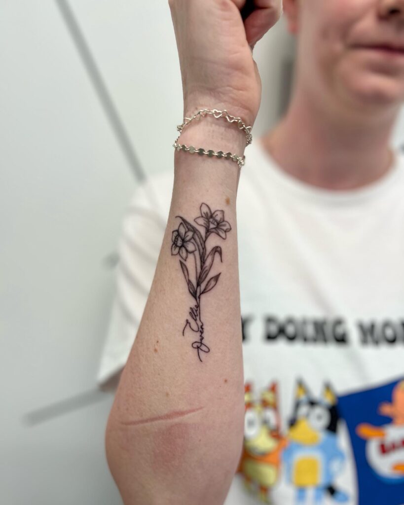 Narcissus Flower Tattoo with Handwritten Name Stem december birth flower tattoo ideas tattoo