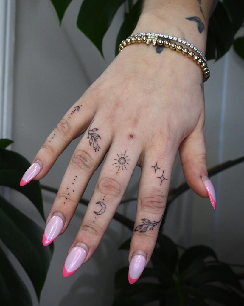 Minimalist Ornamental Finger Tattoo
