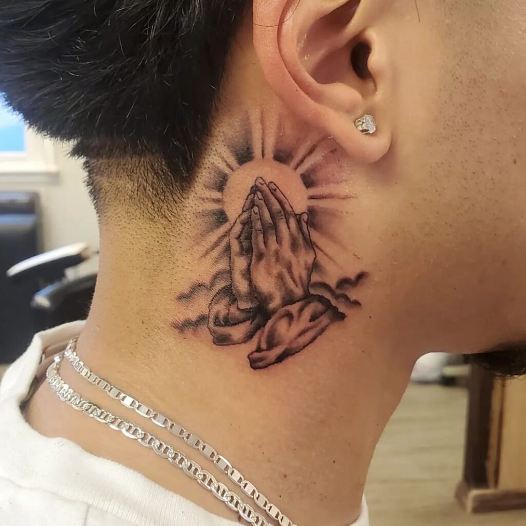 Neck Praying Hands with Sunburst and Clouds Tattoo praying hands tattoos tattoo